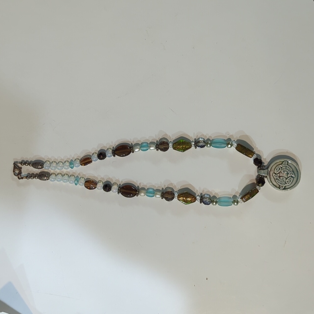 Necklace with fish pendant